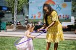 an adult and childl hula hooping